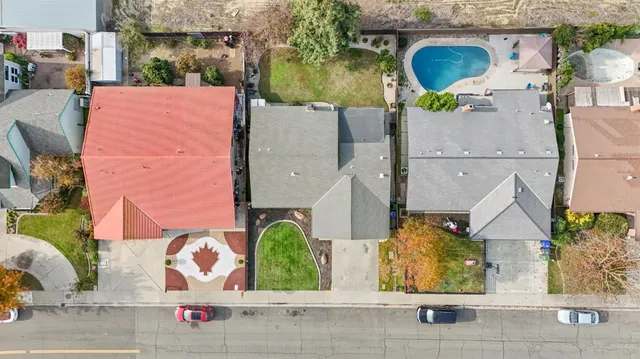 an aerial view of houses with outdoor space