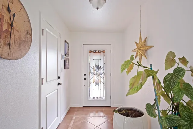 a bathroom with a window a light fixture and a window
