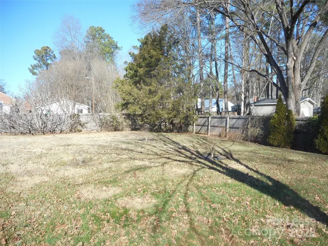 a view of a yard with trees