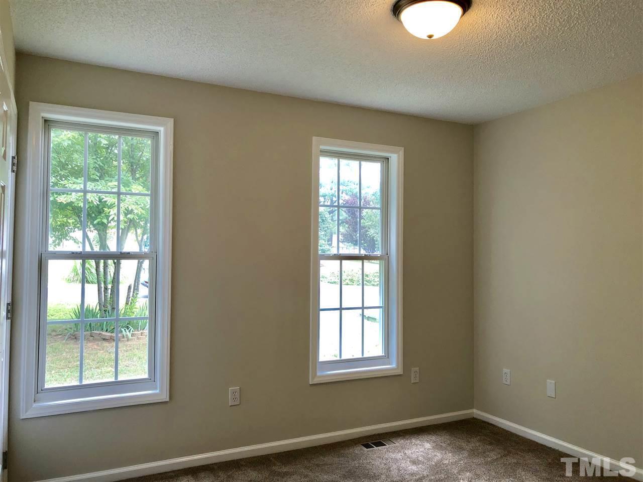 2825 Glastonbury Road Apex, NC 27539 - Photo 14 of 21 a view of an empty room with a window