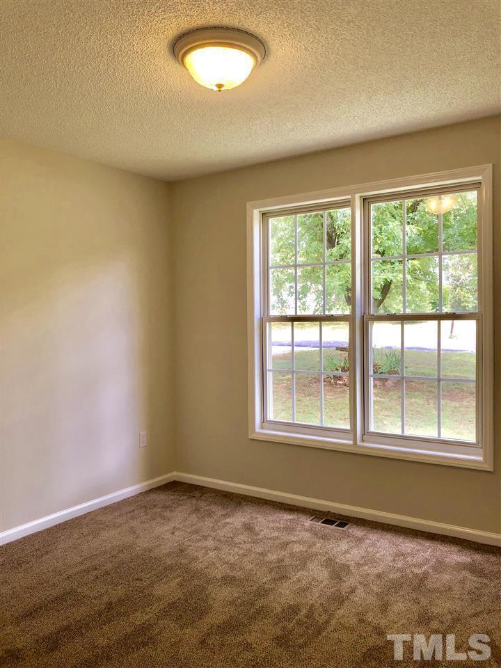 2825 Glastonbury Road Apex, NC 27539 - Photo 15 of 21 an empty room with a empty space and a window