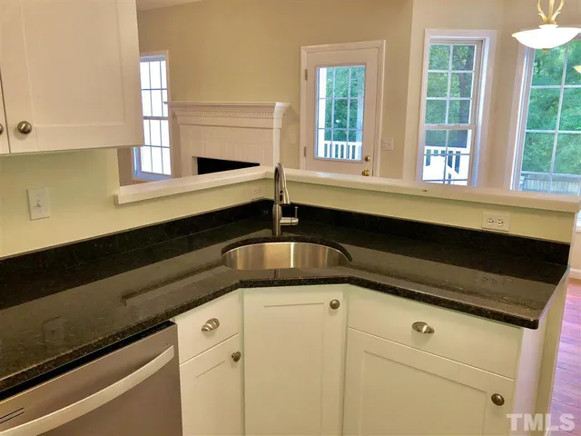 a kitchen with a sink and a window