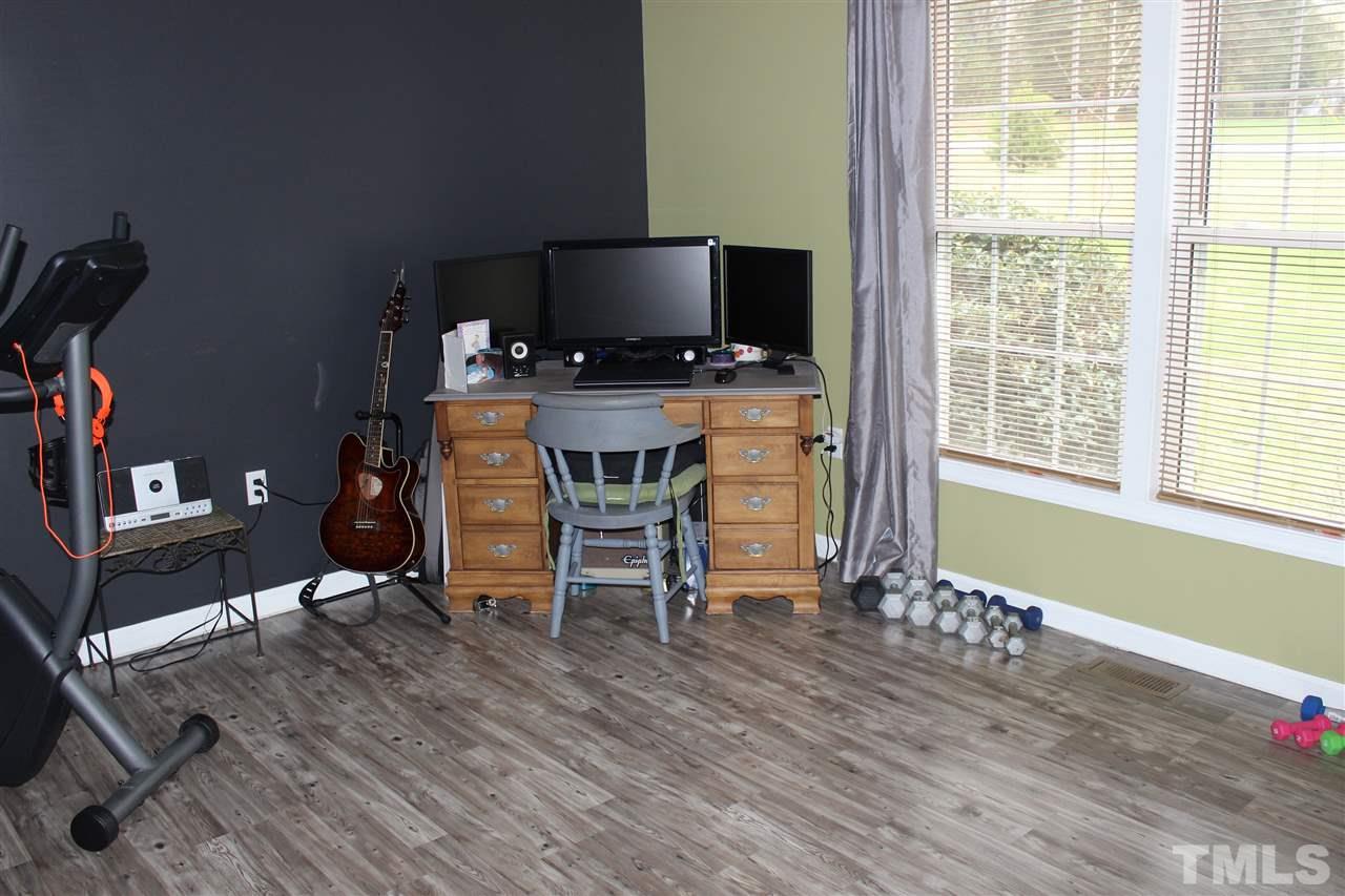 462 Pixley Pritchard Road Timberlake, NC 27583 - Photo 13 of 25 a view of a workspace with furniture and a window