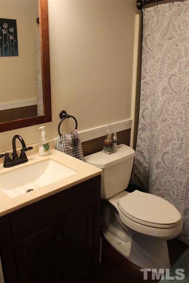 462 Pixley Pritchard Road Timberlake, NC 27583 - Photo 16 of 25 a bathroom with a sink and a toilet
