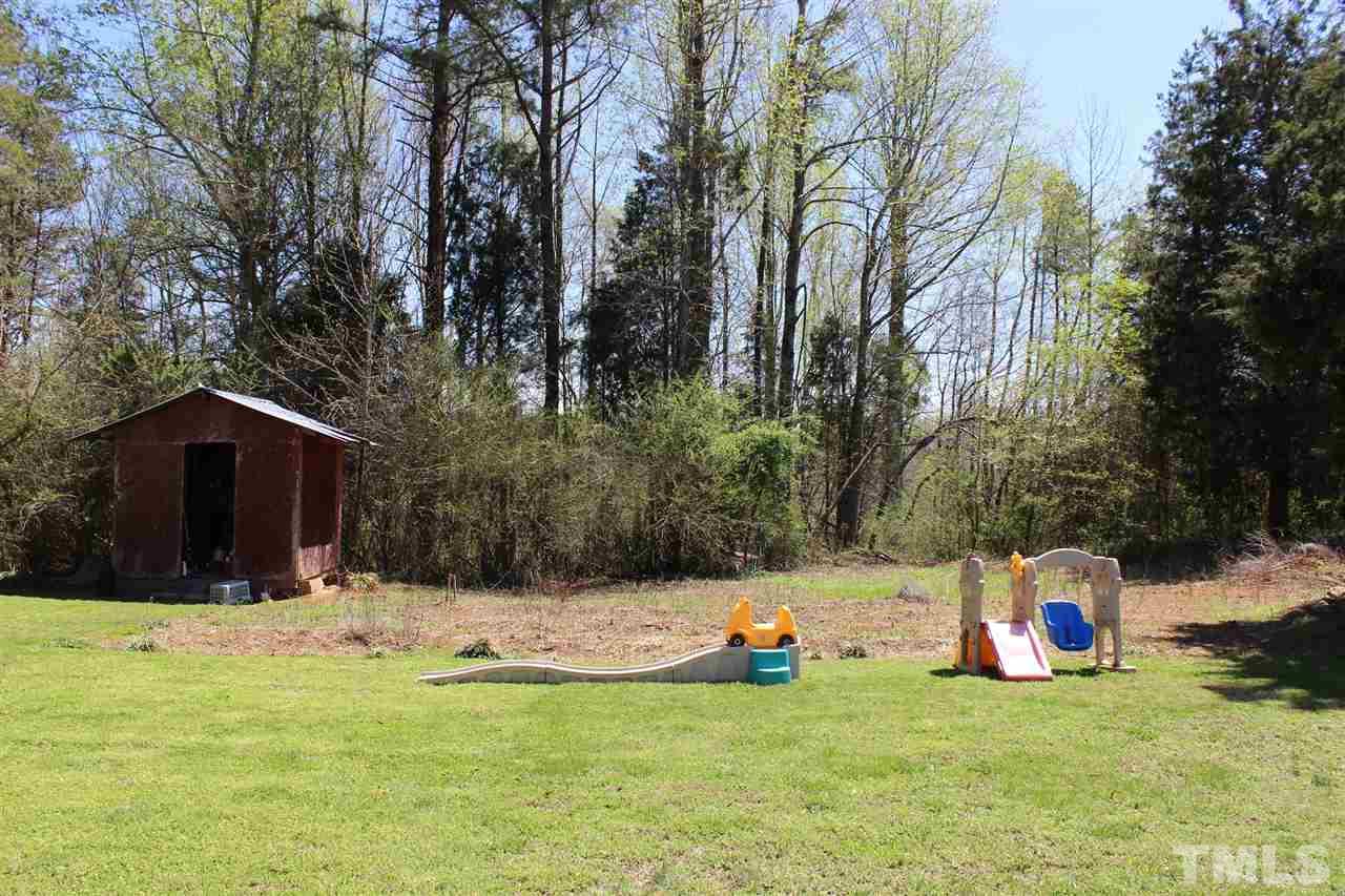 462 Pixley Pritchard Road Timberlake, NC 27583 - Photo 23 of 25 a view of swimming pool with a backyard and trees