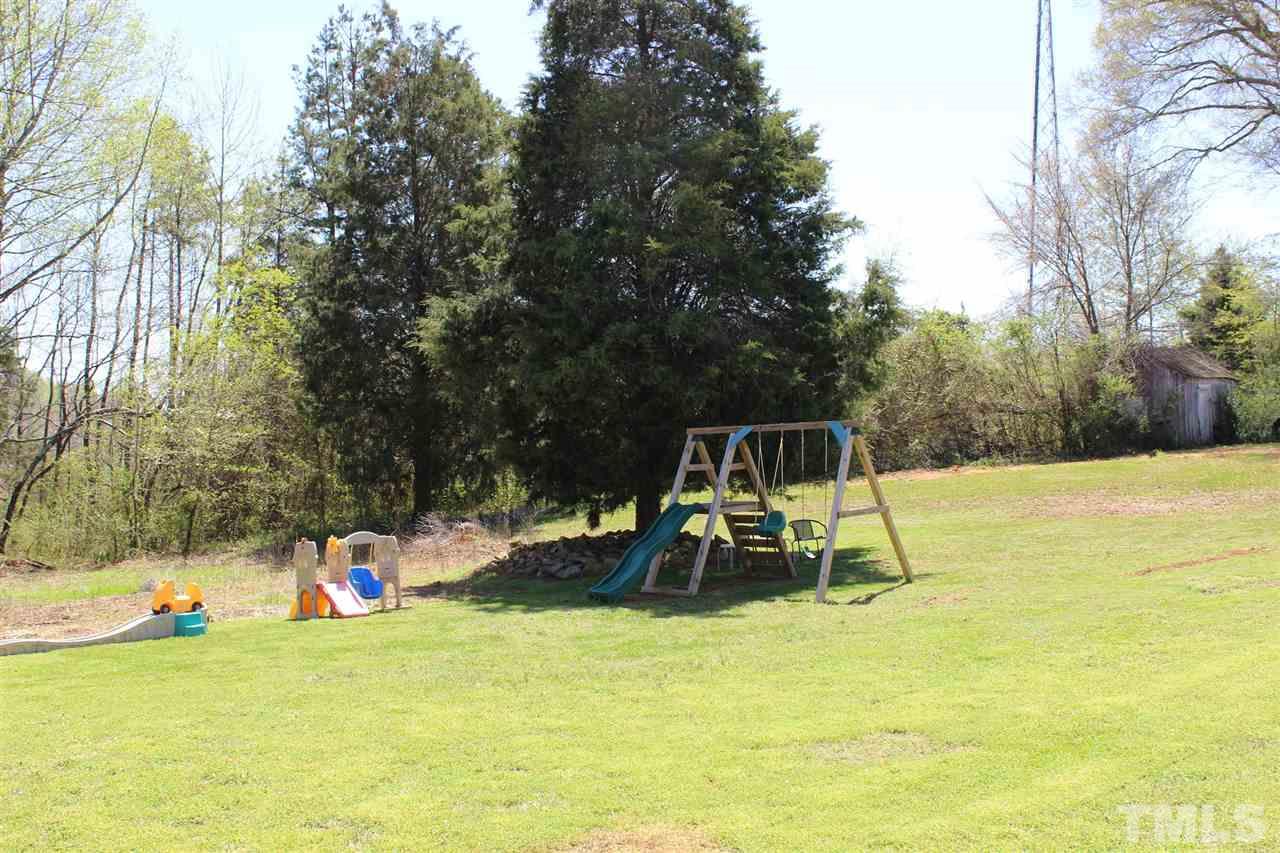 462 Pixley Pritchard Road Timberlake, NC 27583 - Photo 24 of 25 a view of a park with swings and slides
