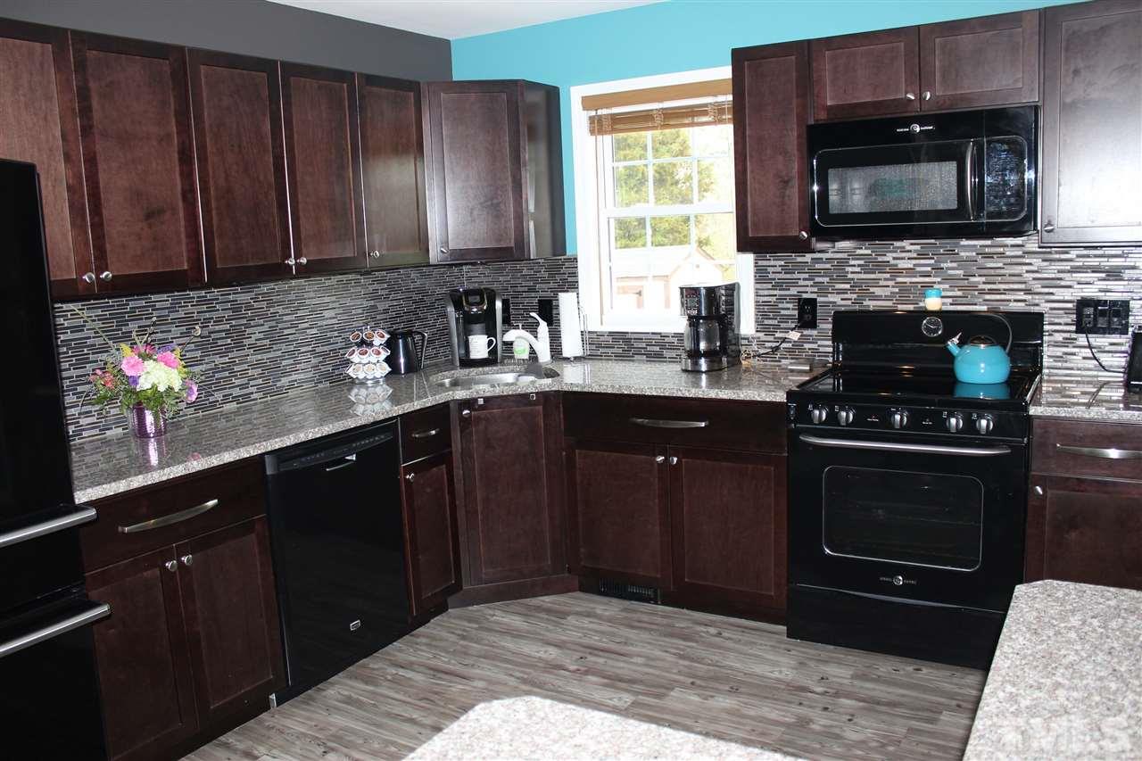 462 Pixley Pritchard Road Timberlake, NC 27583 - Photo 4 of 25 a kitchen with a sink stove and microwave