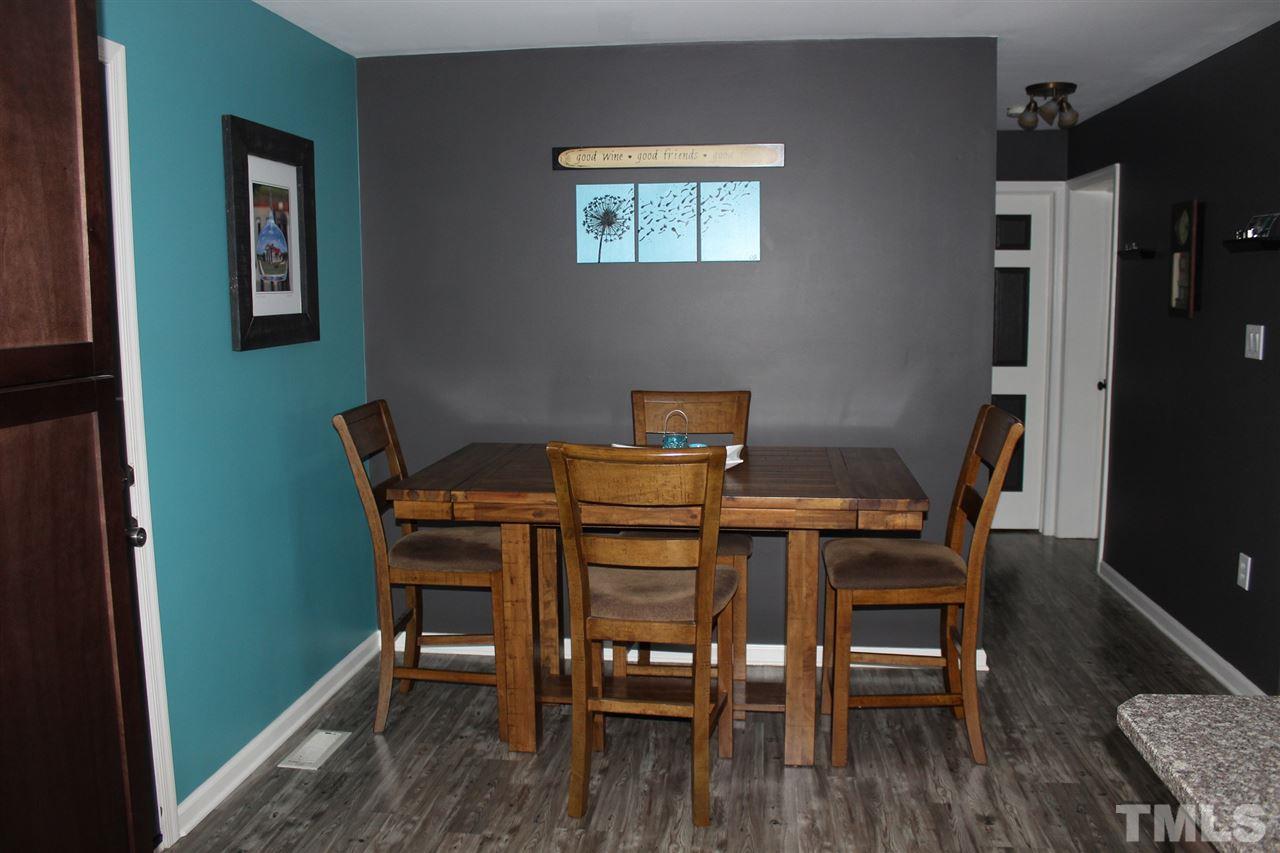 462 Pixley Pritchard Road Timberlake, NC 27583 - Photo 5 of 25 a view of a dining room with furniture and wooden floor