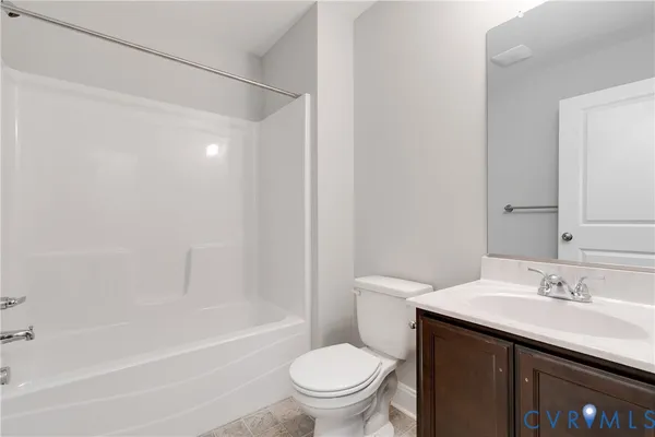 a view of a house with backyard and deck