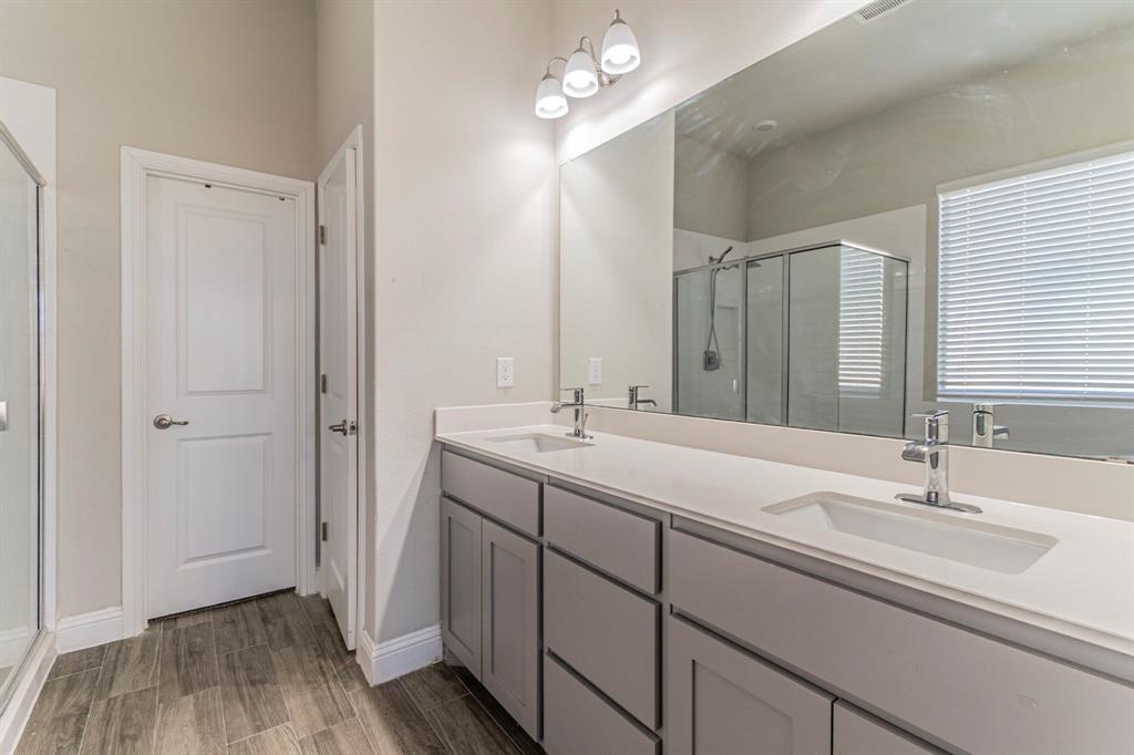 10638 Cherry Tree Way Grand Prairie, TX 76065 - Photo 16 of 39 Primary bathroom featuring dual sinks