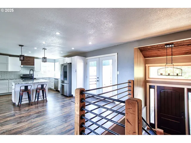 a view of kitchen with furniture and wooden floor