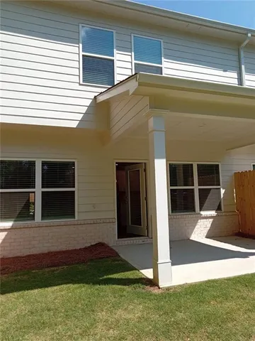 a house view with a backyard space