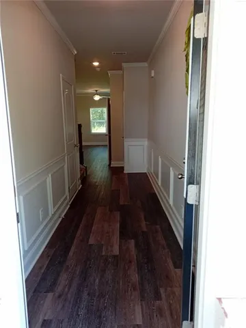 a view of gallery with wooden floor