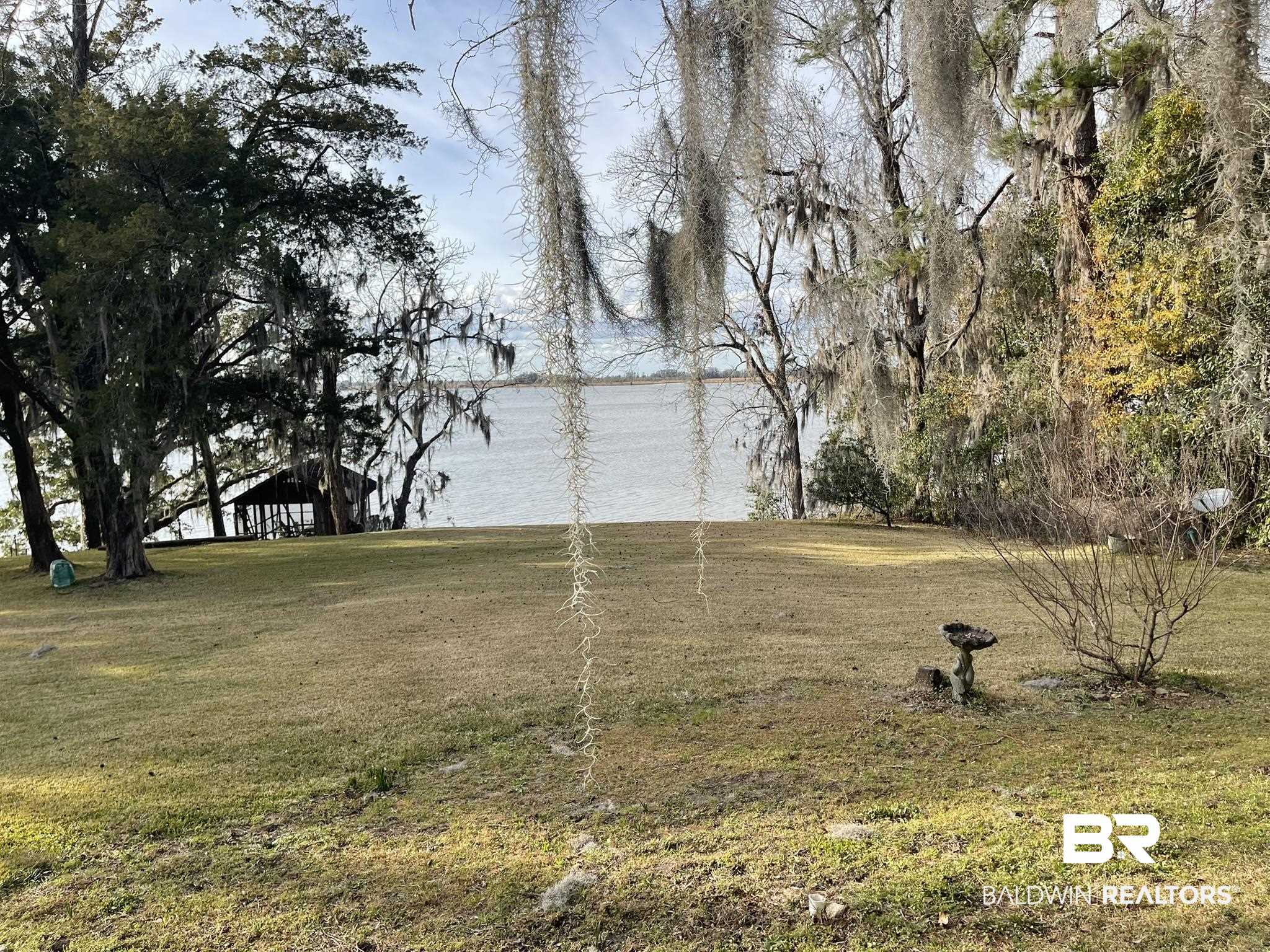 6621 Purvis Road Daphne, AL 36527 - Photo 8 of 59 View of grassy yard featuring a water view