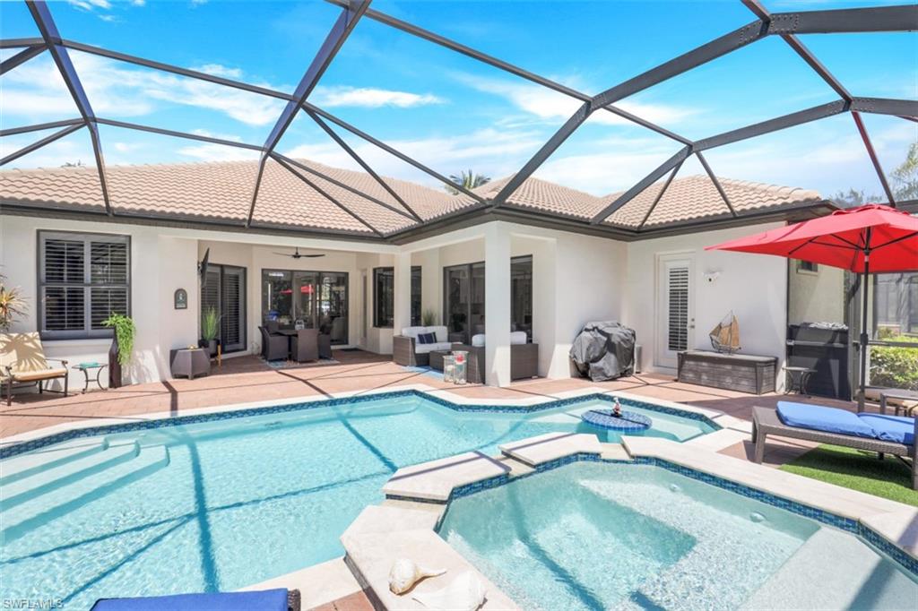 7323 Acorn Way Naples, FL 34119 - Photo 22 of 28 Remodeled pool/hot tub featuring screened enclosure, an outdoor living space and a new outdoor kitchen (not shown).