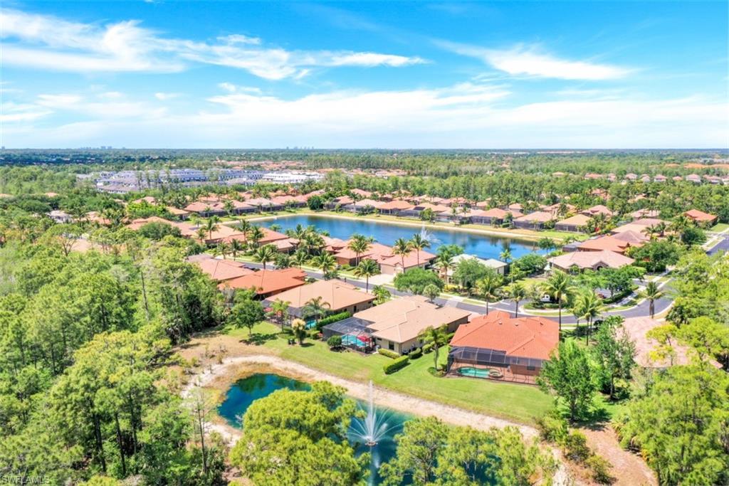 7323 Acorn Way Naples, FL 34119 - Photo 23 of 28 Aerial view of residential area featuring a large body of water