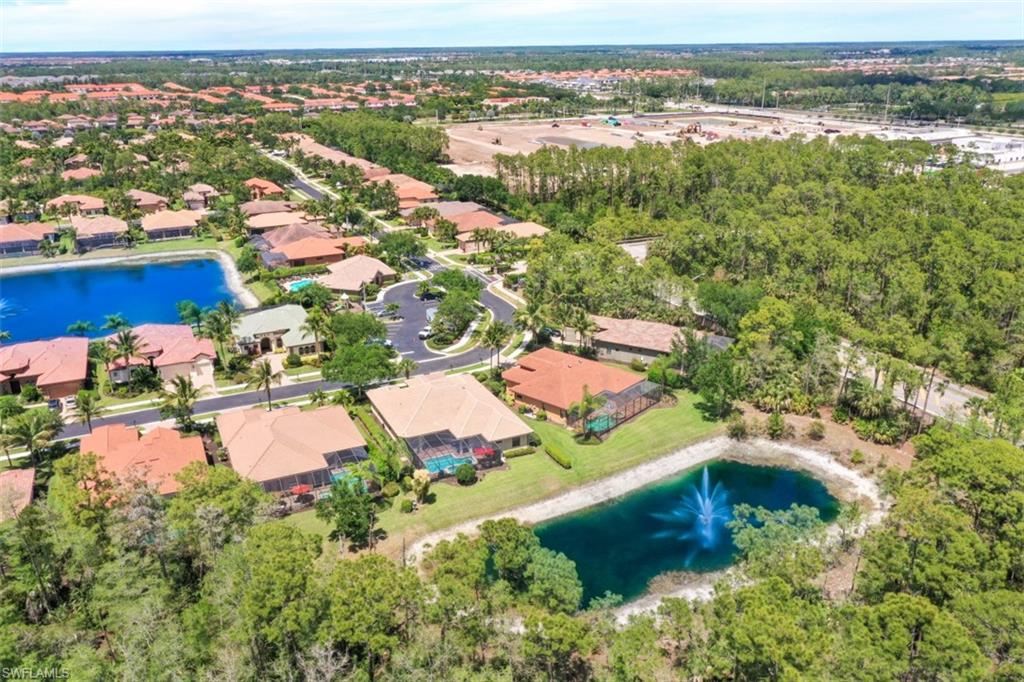 7323 Acorn Way Naples, FL 34119 - Photo 26 of 28 Aerial view of Black Bear Ridge featuring 2 lakes and fountains