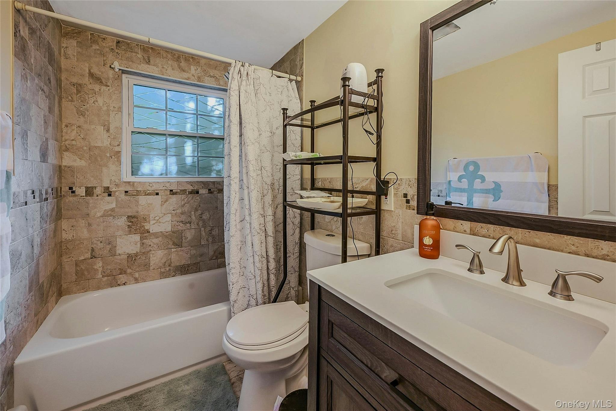 196 Church Drive Mastic Beach, NY 11951 - Photo 12 of 15 a bathroom with a sink toilet and shower
