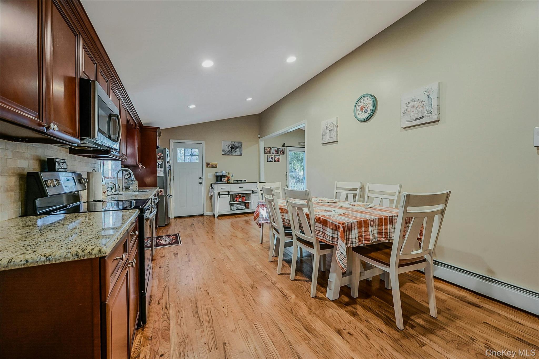 196 Church Drive Mastic Beach, NY 11951 - Photo 5 of 15 a view of a kitchen with dining area