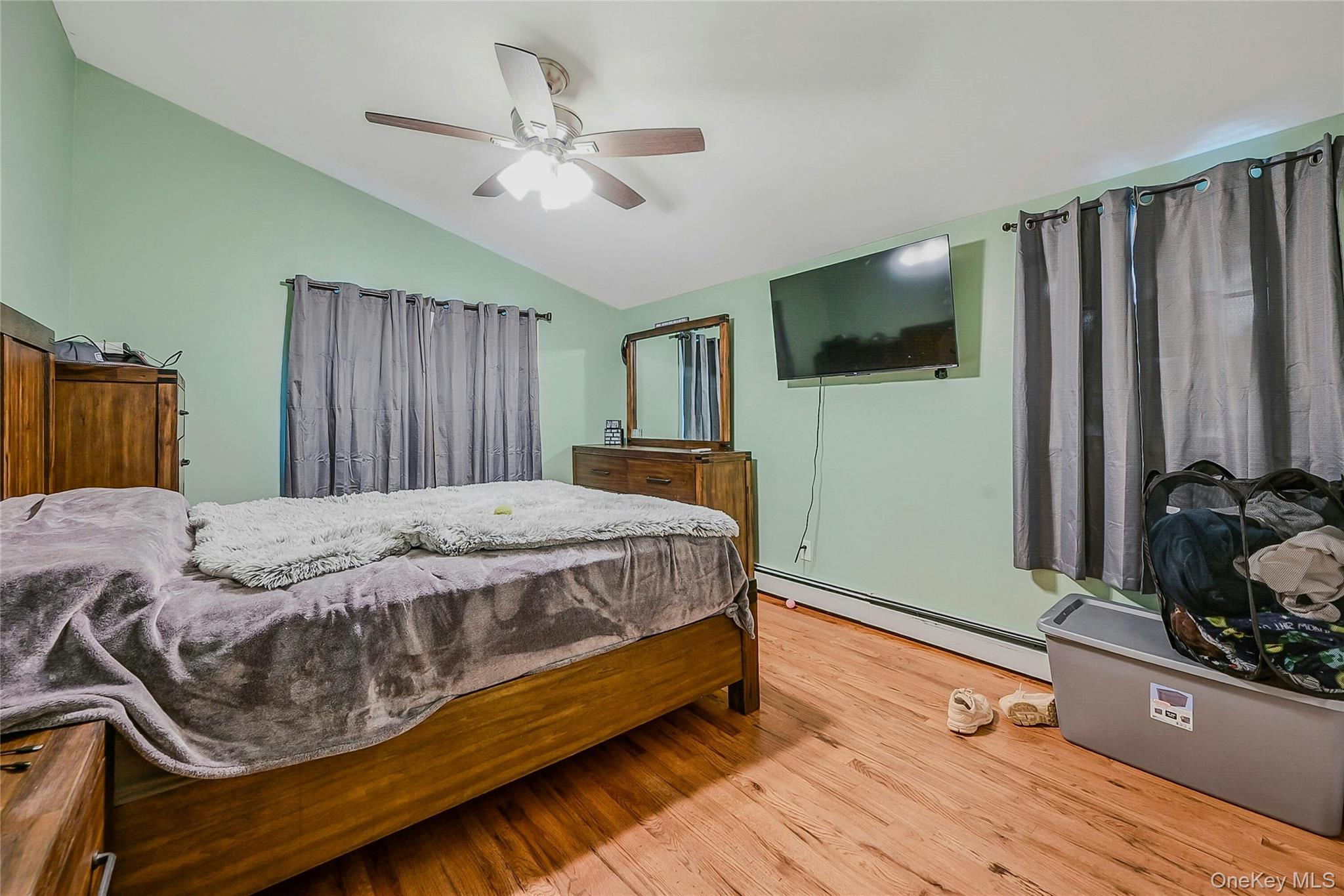196 Church Drive Mastic Beach, NY 11951 - Photo 9 of 15 a bed sitting in a bedroom and a flat tv screen