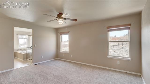 2316 Rusty Ridge Court Colorado Springs, CO 80921 - Photo 22 of 46 Large Master bedroom with on-suite bathroom, can easily fit a King Size bed.