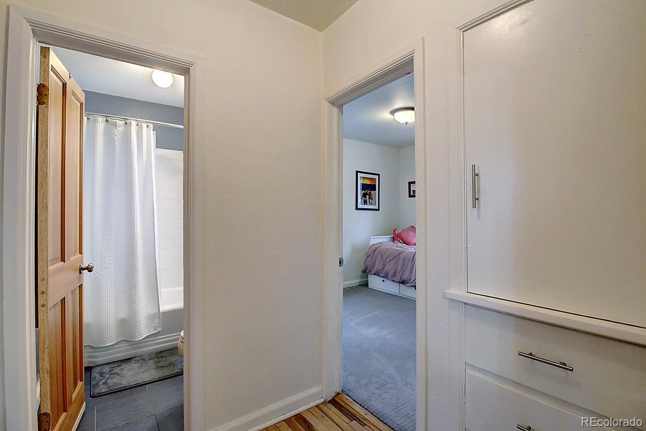 4075 Quay Street Wheat Ridge, CO 80033 - Photo 18 of 38 a hallway with kids room bathroom