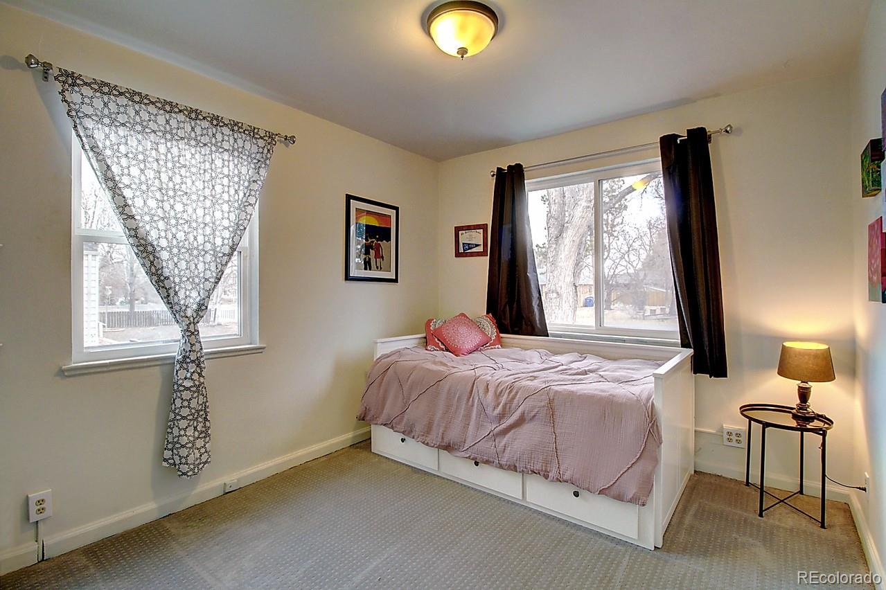 4075 Quay Street Wheat Ridge, CO 80033 - Photo 20 of 38 a bedroom with a bed and a window