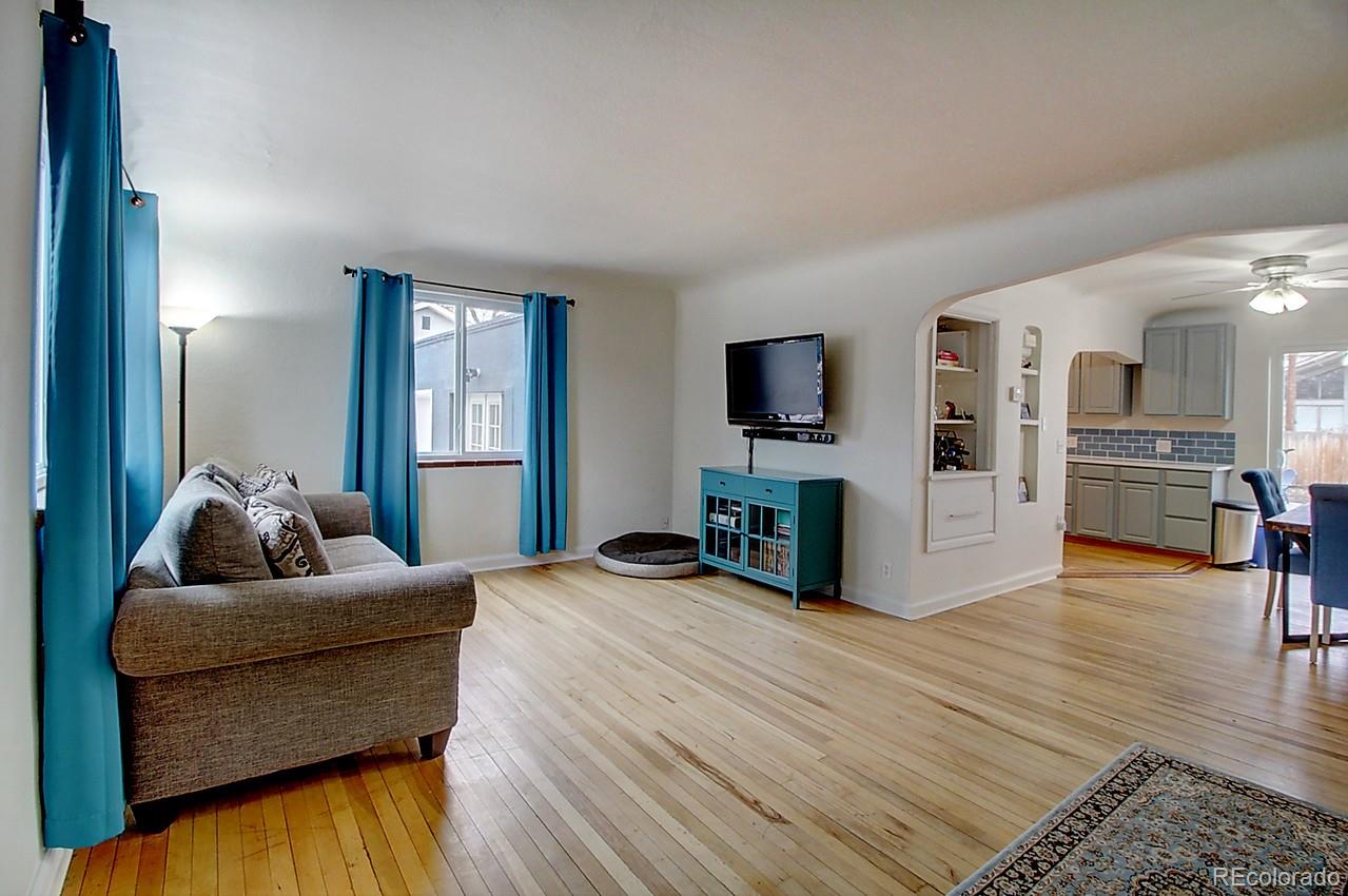 4075 Quay Street Wheat Ridge, CO 80033 - Photo 2 of 38 a bedroom with furniture and a flat screen tv