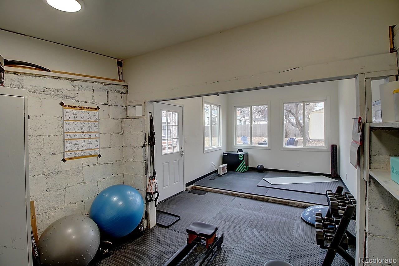 4075 Quay Street Wheat Ridge, CO 80033 - Photo 30 of 38 a room with gym equipment and windows