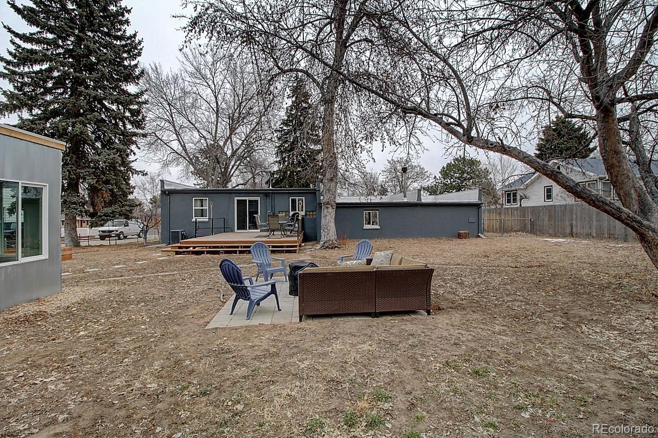 4075 Quay Street Wheat Ridge, CO 80033 - Photo 34 of 38 a front view of house with swing chair and table
