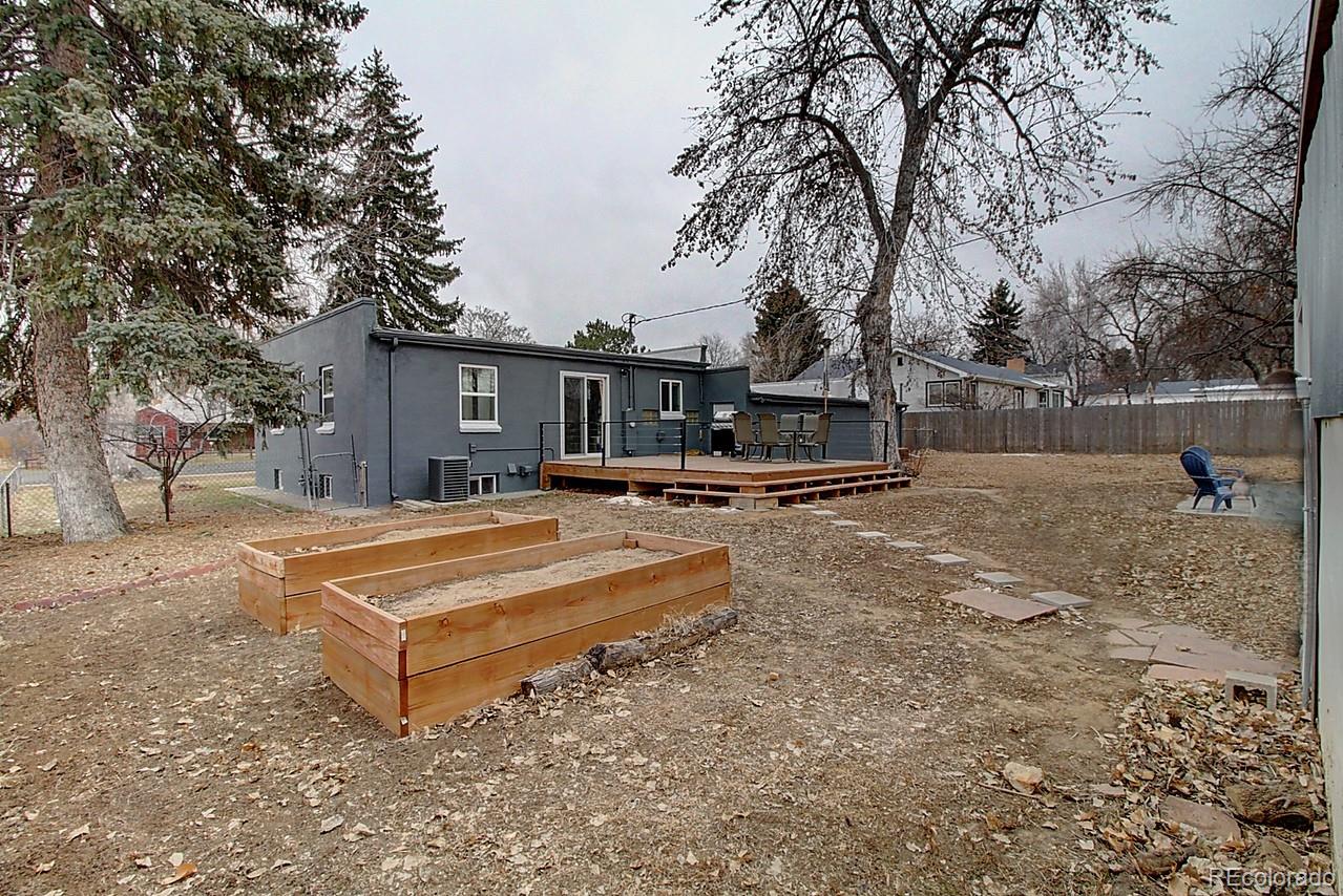 4075 Quay Street Wheat Ridge, CO 80033 - Photo 35 of 38 a view of a house with swimming pool and trees