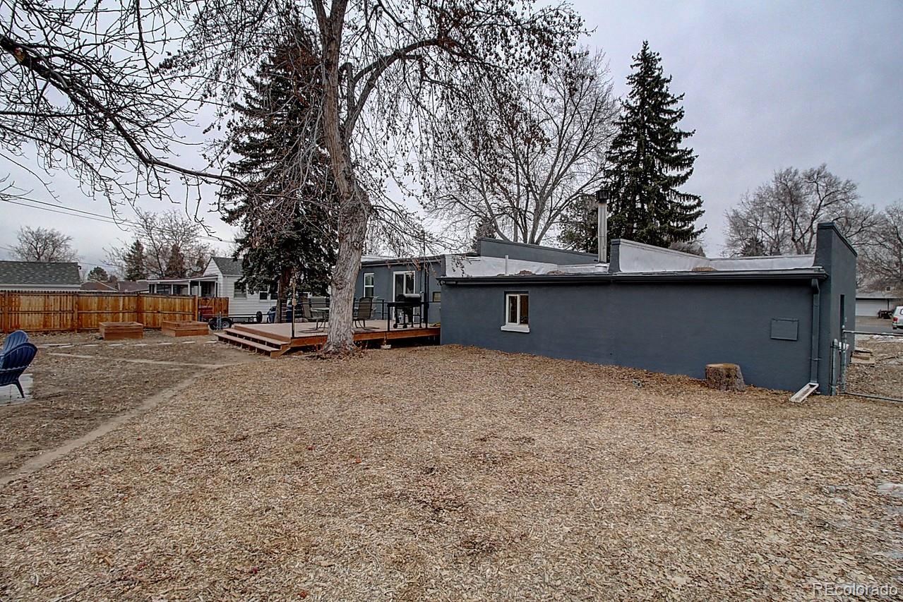 4075 Quay Street Wheat Ridge, CO 80033 - Photo 36 of 38 a view of outdoor space with deck and tree