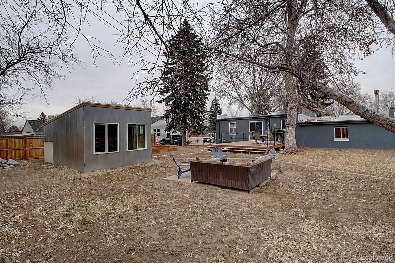 4075 Quay Street Wheat Ridge, CO 80033 - Photo 37 of 38 a front view of a house with a yard