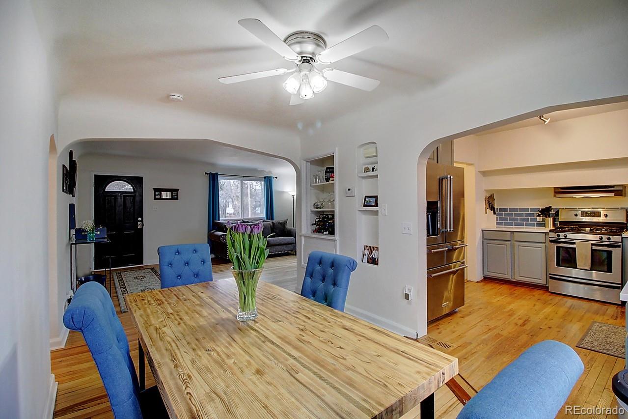 4075 Quay Street Wheat Ridge, CO 80033 - Photo 6 of 38 a view of a dining room with furniture and wooden floor
