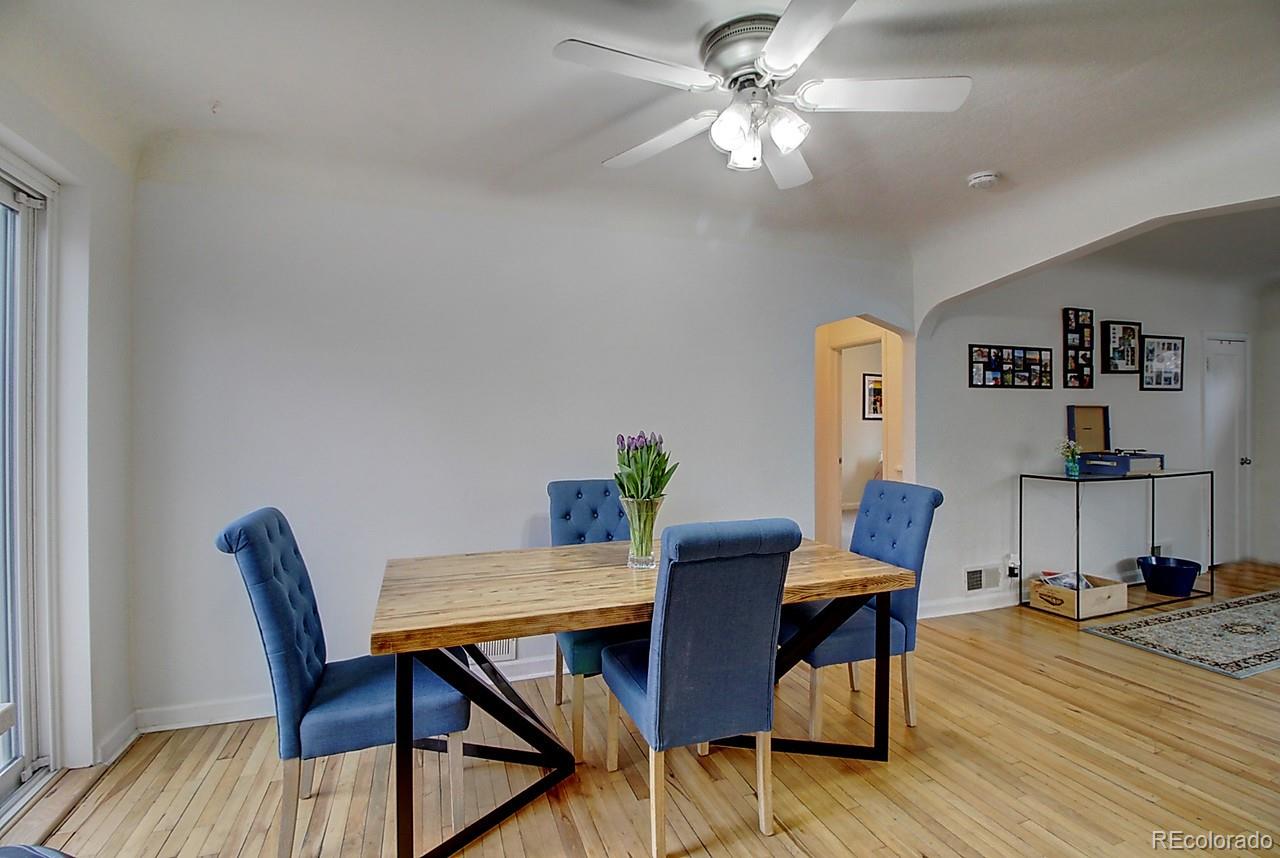 4075 Quay Street Wheat Ridge, CO 80033 - Photo 7 of 38 a view of a dining room with furniture and wooden floor