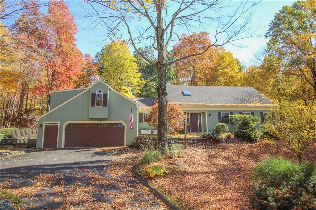 235 Tuttle Road Woodbury, CT 06798 - Photo 1 of 1 a front view of house with yard and trees around