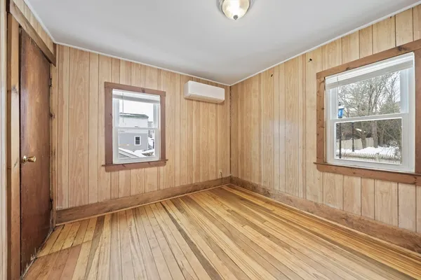 a view of a livingroom with wooden floor