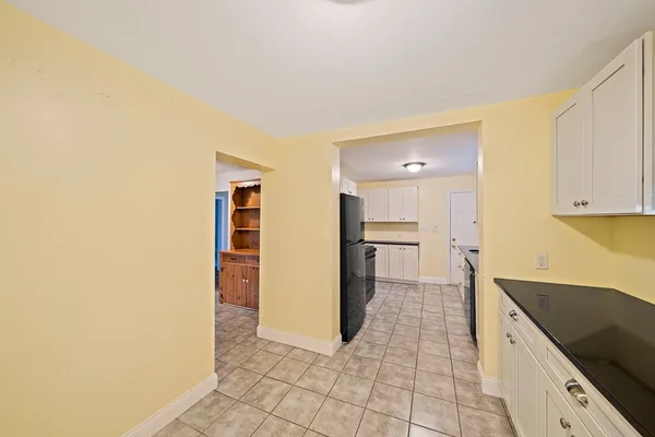 a kitchen with stainless steel appliances a refrigerator and a stove
