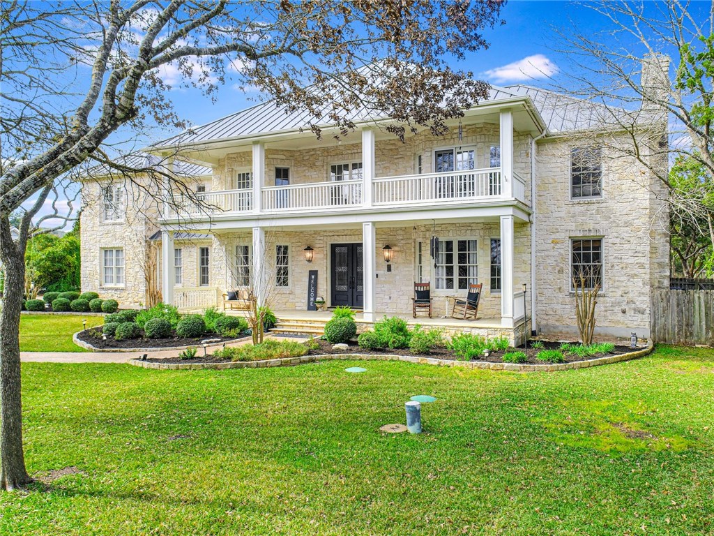 a front view of the house with a yard