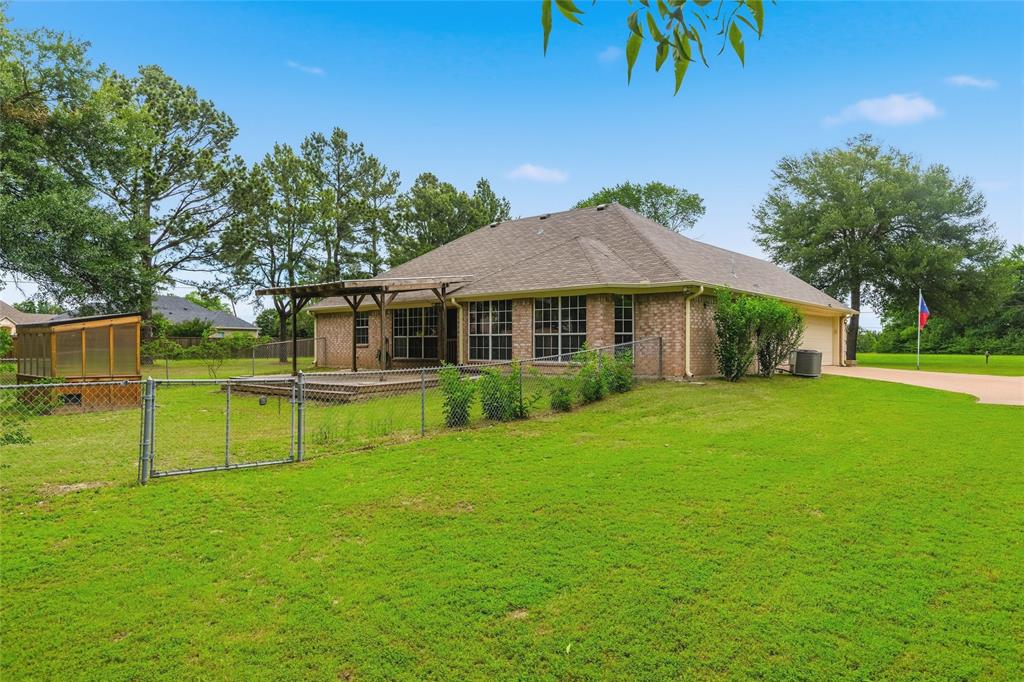 2917 Harlow Road Commerce, TX 75428 - Photo 3 of 40 a front view of a house with a yard