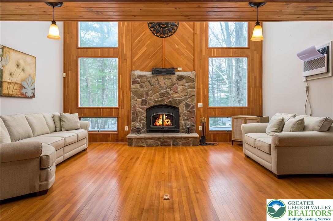 169 Shiny Mountain Road Greentown, PA 18426 - Photo 12 of 54 a living room with furniture and a fireplace
