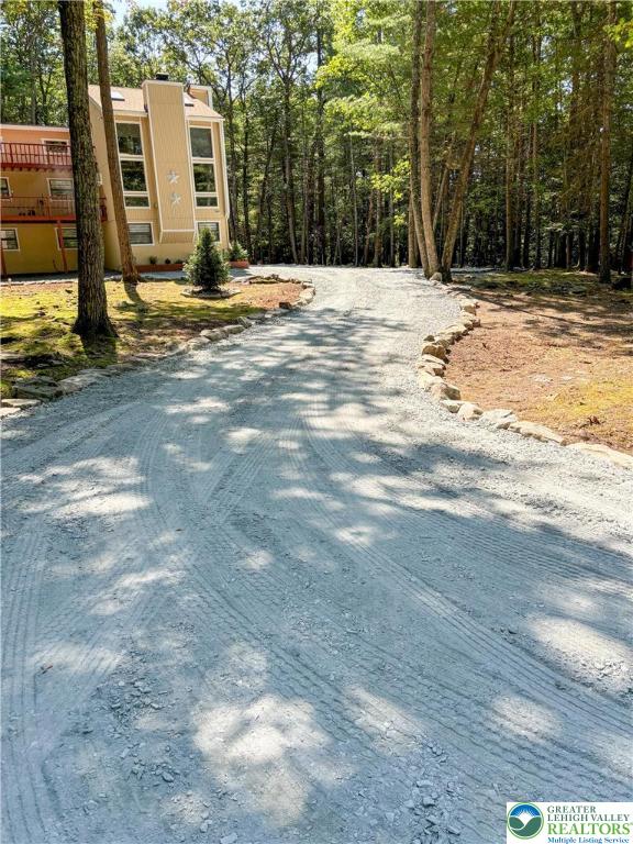 169 Shiny Mountain Road Greentown, PA 18426 - Photo 2 of 54 a view of a house with snow on the road