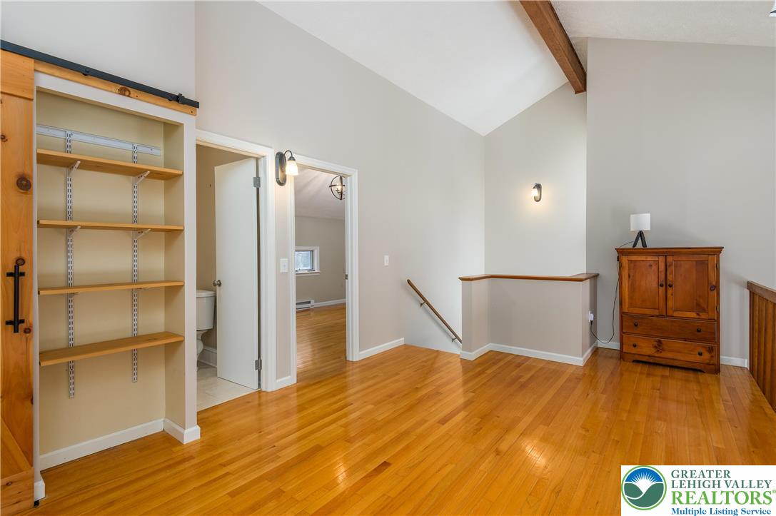 169 Shiny Mountain Road Greentown, PA 18426 - Photo 23 of 54 a bedroom with a bed and wooden floor