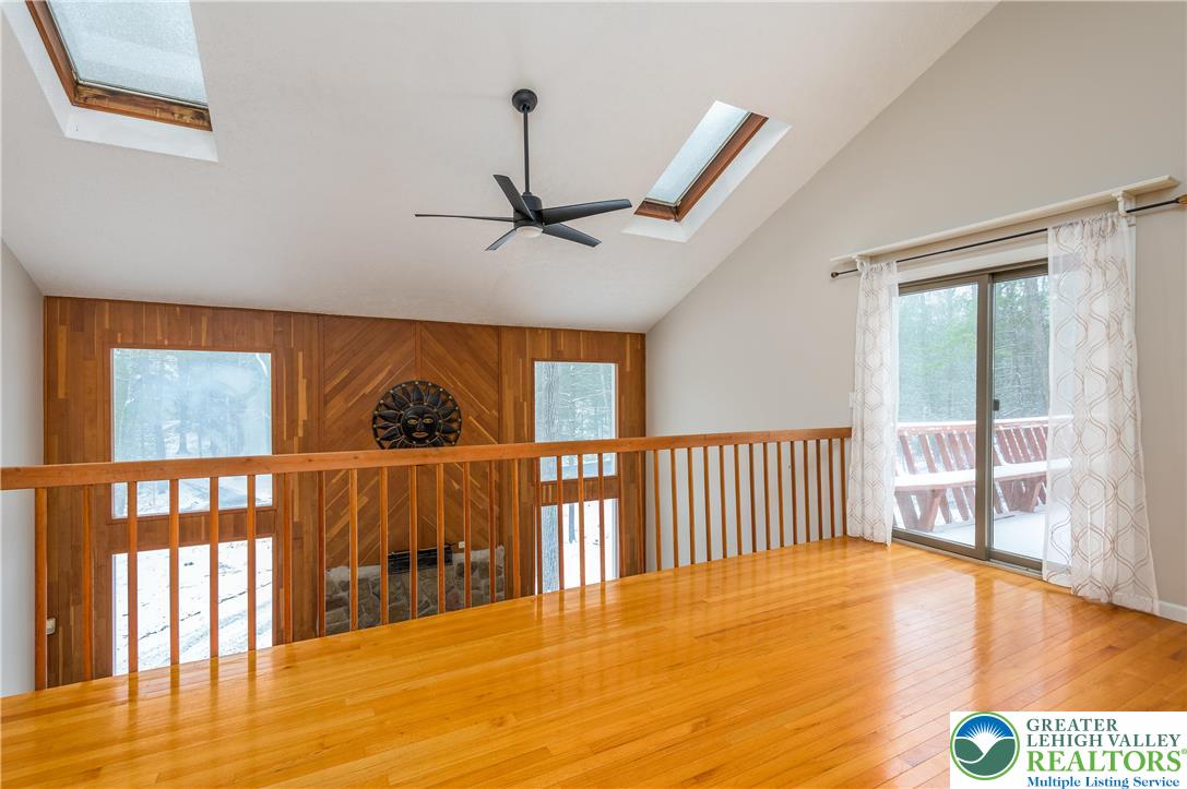 169 Shiny Mountain Road Greentown, PA 18426 - Photo 24 of 54 a view of a room with wooden floor windows and a chandelier
