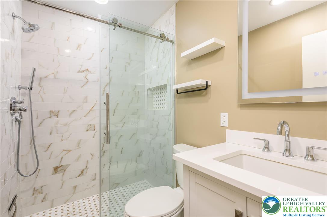 169 Shiny Mountain Road Greentown, PA 18426 - Photo 25 of 54 a bathroom with a sink toilet and shower