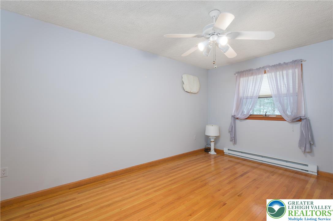 169 Shiny Mountain Road Greentown, PA 18426 - Photo 26 of 54 wooden floor in an empty room with a window