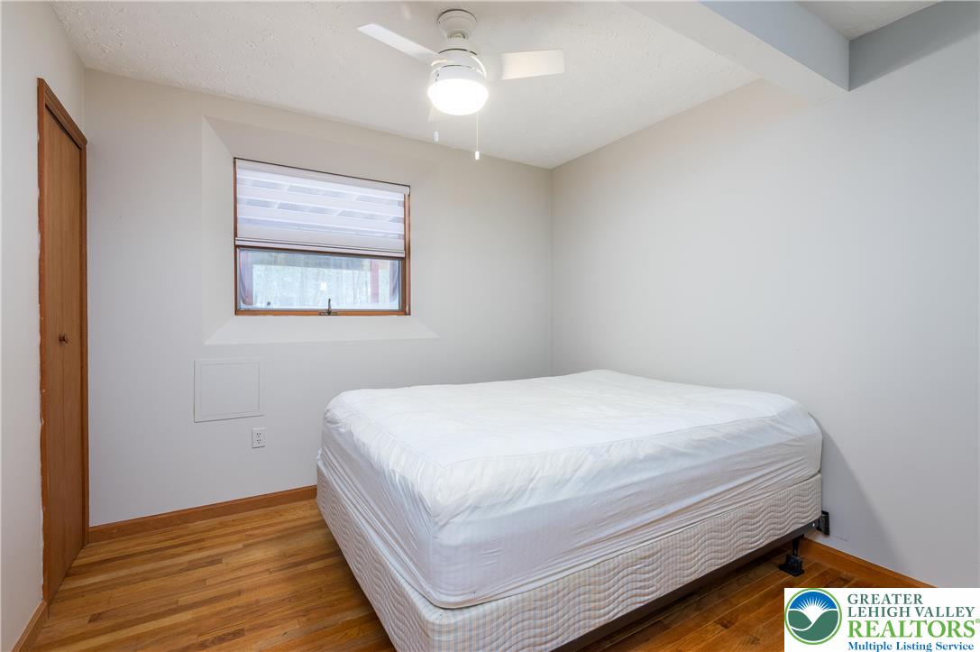 169 Shiny Mountain Road Greentown, PA 18426 - Photo 32 of 54 a bedroom with a bed and a window