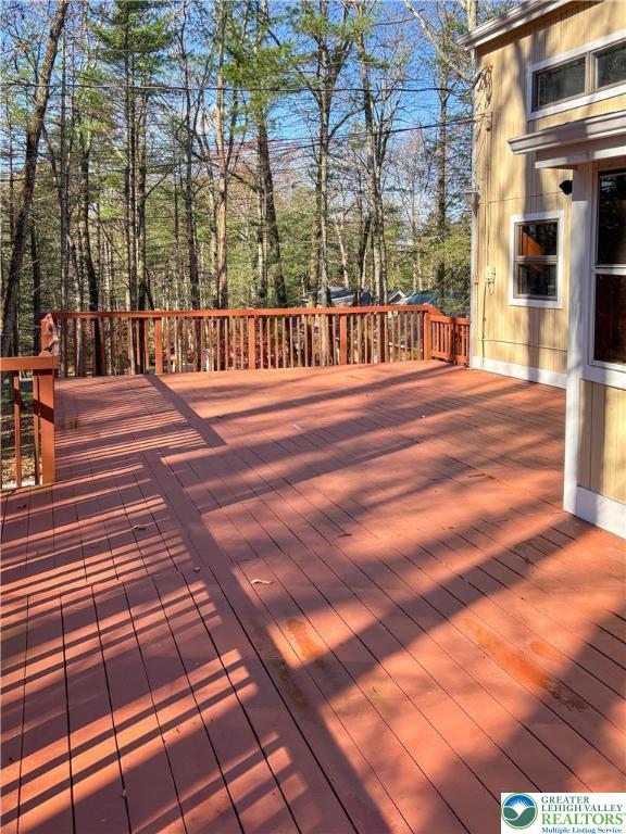 169 Shiny Mountain Road Greentown, PA 18426 - Photo 50 of 54 a view of a patio with a table and chairs on the side of the road