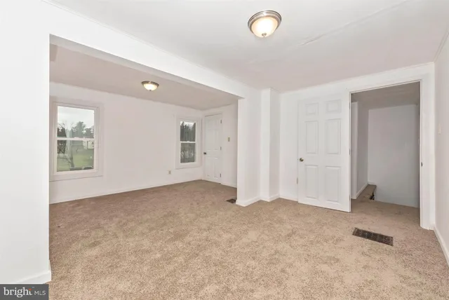 an empty room with windows