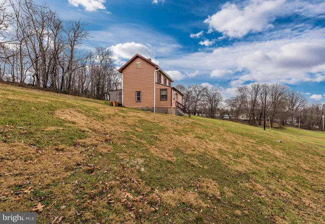 a front view of house with yard and entertaining space